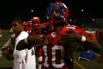 Valley's Gidion Tesfai celebrates a teammate's touchdown during Friday's game against Liberty.