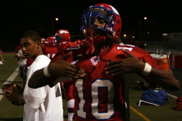 Valley's Gidion Tesfai celebrates a teammate's touchdown during Friday's game ...