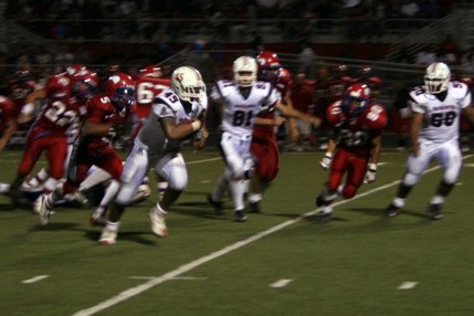 Liberty running back Nua Sage runs the ball during Friday's game at Valley High School.