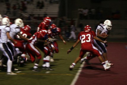 Liberty running back No. 32 Tautoto Carlos scores a touchdown during Friday's game at Valley.