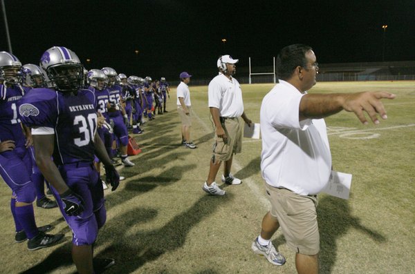 Silverado head football coach Andy Ostolaza, right, yells at his ...