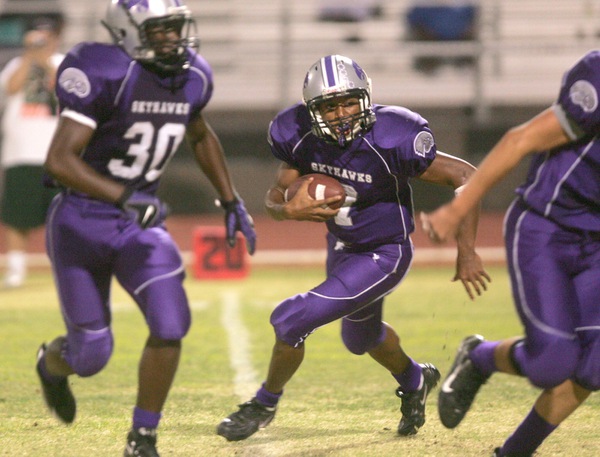 Silverado quarterback Trenton Tiptom runs the ball during a home ...