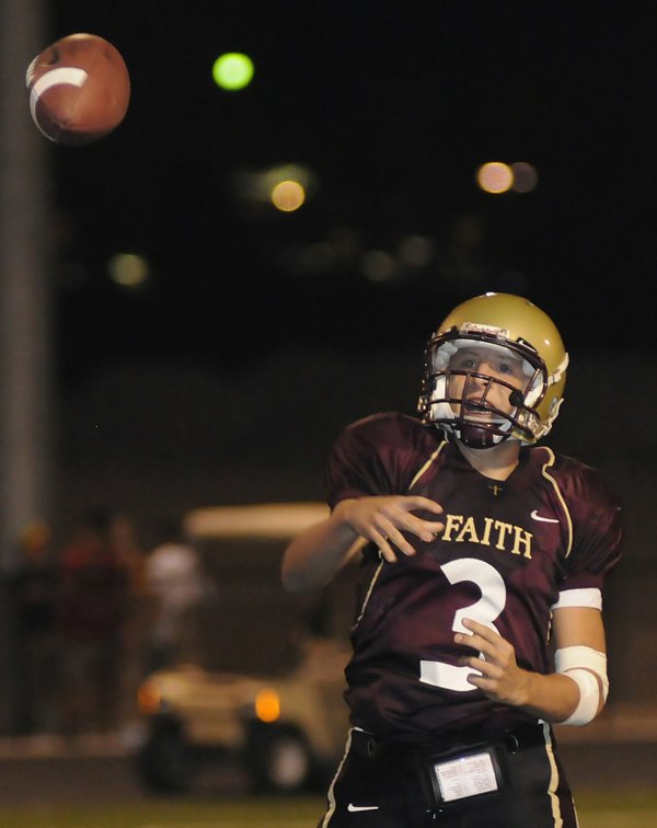 Faith Lutheran quarterback Joe Portaro lets a pass go in ...