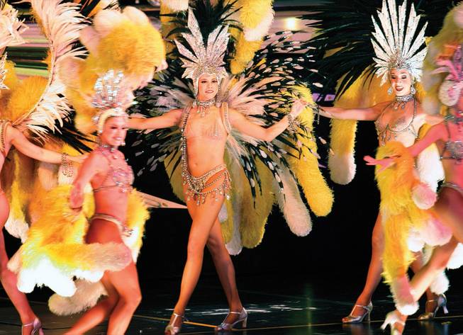 Katie Currow, center, during a performance of "Donn Arden's Jubilee!," one of two surviving Las Vegas showgirl extravaganzas, at Bally's on Aug. 17. is flanked by Amelia Bruff, left, and Jenny Lee. 
