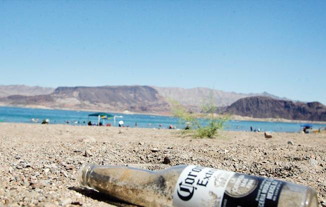A beer bottle litters the shore at Lake Mead earlier this month.