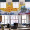 Several murals grace the walls of Robert Taylor Elementary School courtesy of Henderson artist Shawn Ealy, who attended at the original campus. In the library, the library specialist requested a bright, colorful theme set off by the centerpiece cartoon sun and book. Outside the window is a patriotic mural Ealy painted in the courtyard.