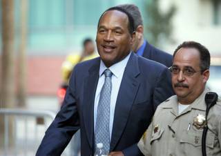 O.J. Simpson arrives at the Clark County Regional Justice Center on the third day of jury selection for his trial Sept. 10, 2008, in Las Vegas, Nev. Simpson is facing charges which include burglary, robbery and assault following an alleged robbery at the Palace Station Hotel & Casino in September, 2007. 