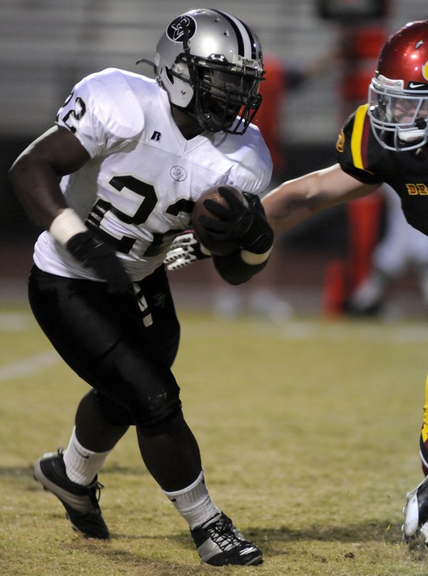 Palo Verde running back Torin Harris reaches for a touchdown ...