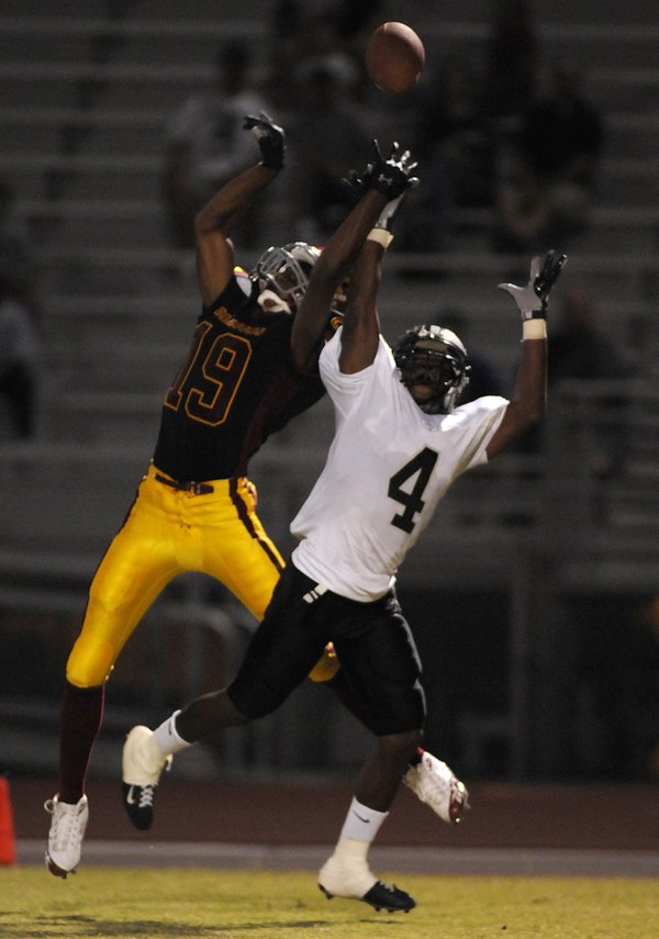 Dragons wide receiver Chris Jones (19) leaps for a long ...