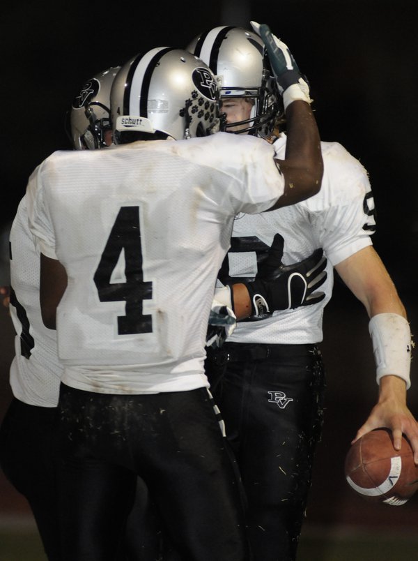 Palo Verde's Kelly Zurowski (9), right, is congratulated by teammate ...