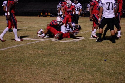 Liberty's defense takes down Durango senior running back Romell Maxwell in the third quarter on Friday night. 