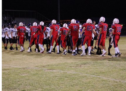 Liberty and Durango players shake hands after the game on Friday night. Liberty defeated Durango, 35-7. 