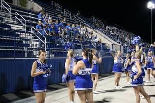 Dixie High School cheerleaders offer some school spirit in front of the group that made the trip from Utah. Bishop Gorman defeated Dixie, 20-14, in overtime.