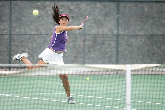 Silverado's Kristen Santero runs across the court to return the ball to her opponent during a tennis match at Silverado.