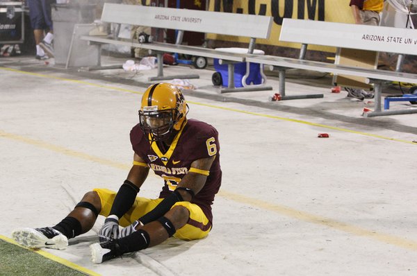 Arizona State player Kyle Williams (6) sits in front of ...