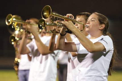 Kelsey Ripplinger plays the trumpet during the halftime show during Friday's home opener against River Valley of Mohave, Ariz.