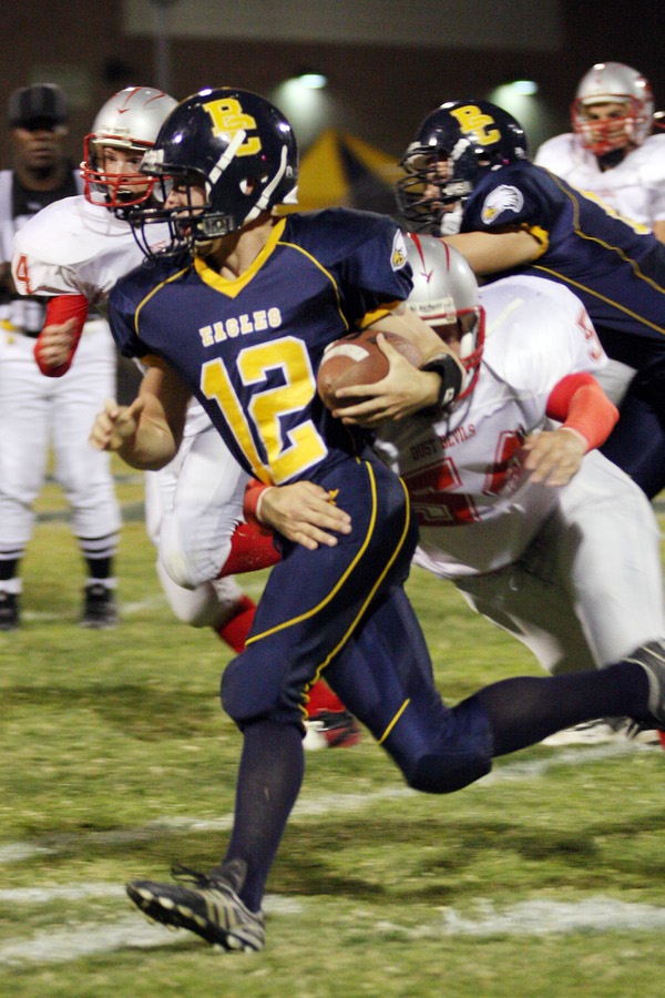 Boulder City quarterback Jake Phillips makes a run in an ...