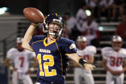 Boulder City quarterback Jake Phillips makes a pass to during the football home opener against River Valley of Mohave, Ariz.