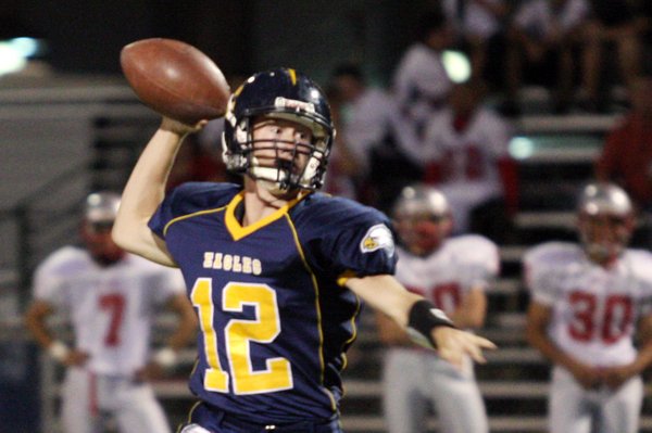 Boulder City quarterback Jake Phillips makes a pass to during ...