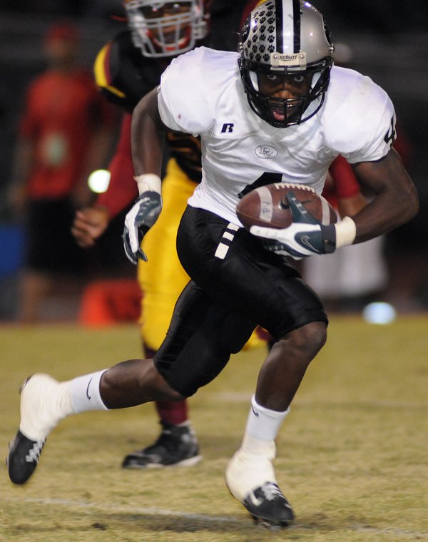 Panthers running back Sidney Hodge looks upfield during a punt ...