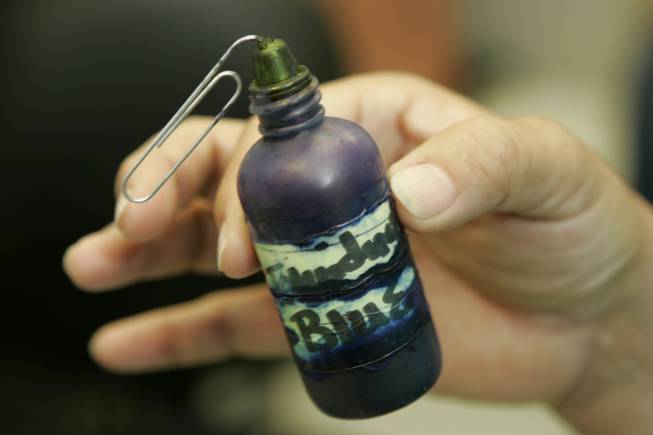 A bottle of Toluidine Blue, a dye that highlights injuries