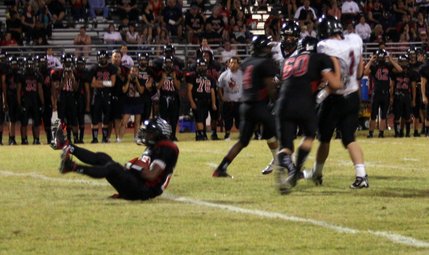 Las Vegas' Nico Villarama clutches the ball after slipping on the field.