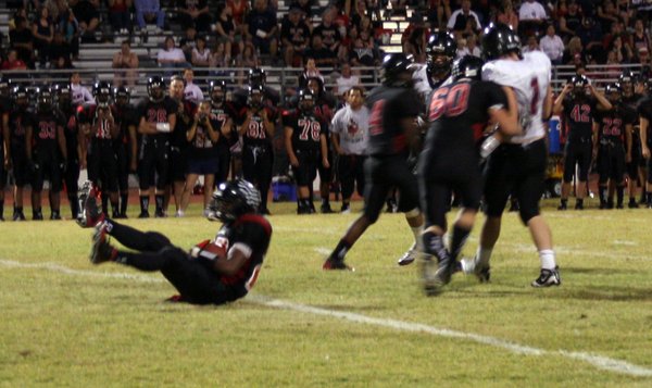 Las Vegas' Nico Villarama clutches the ball after slipping on ...