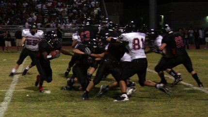 Las Vegas running back Reggie Bullock maneuvers around other players during the second quarter of Friday's game against Pine View.