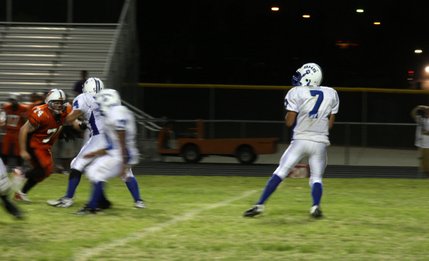 Basic High School quarterback Robby Faiman prepares to pass the ball during Friday night's game at Chaparral High School.