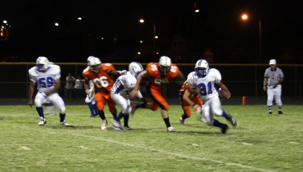 Basic running back Charles Phillips breaks past Chaparral's defenses on ...