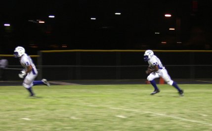 Basic's Charles Phillips runs the ball up the field during Friday's game at Chaparral.
