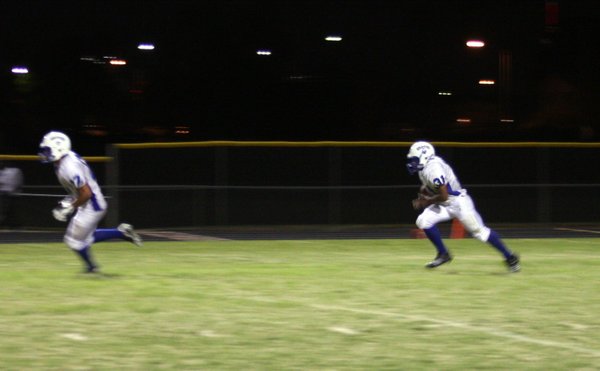 Basic's Charles Phillips runs the ball up the field during ...