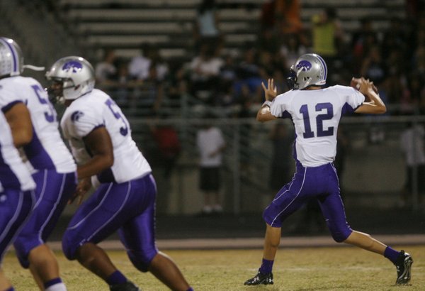 Silverado quarterback Kyle Simmons (12) throws a pass during an ...