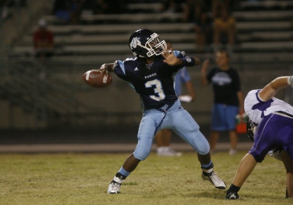 Centennial quarterback Chris Henderson (3) throws a pass during a ...