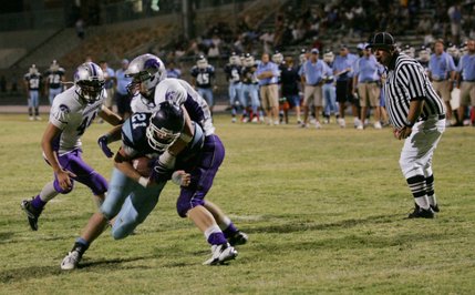 Centennial's Matt Holley (21) runs the ball during a home game against Silverado on Sept. 12.