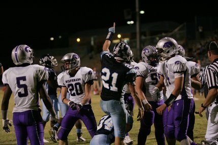 Centennial's Matt Holley (21) reacts after a play during Friday's home game against Silverado.