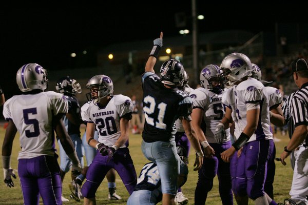 Centennial's Matt Holley (21) reacts after a play during Friday's ...