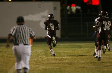 Cimarron-Memorial quarterback Kenneth Banks (9) runs for a touchdown during a home game against Desert Pines Friday night.