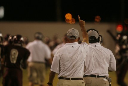 Cimarron-Memorial head coach Rod Vollan holds up his hand after quarterback Kenneth Banks scores a touchdown during a home game against Desert Pines Friday night.