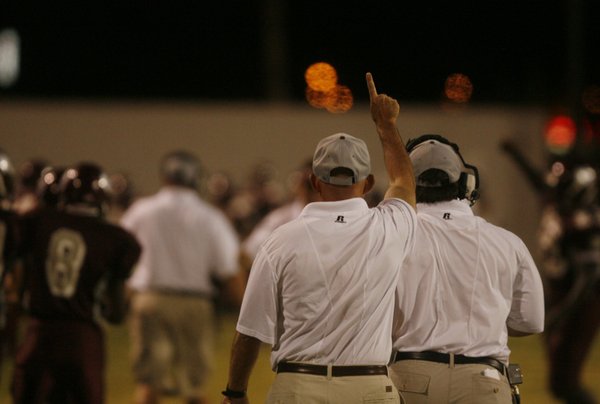 Cimarron-Memorial head coach Rod Vollan holds up his hand after ...