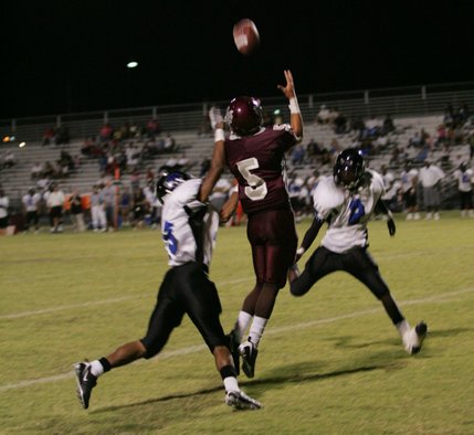 Cimarron-Memorial wide receiver Kevin Bansbach (5),  jumps for a catch during a home game against Desert Pines Friday night.