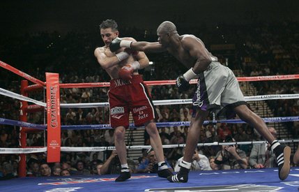 Vernon Forrest (right) of Atlanta connects on WBC super welterweight champion Sergio Mora of Los Angeles during their title rematch at the MGM Grand Garden Arena Saturday night. Forrest reclaimed his title with a 12-round unanimous decision.