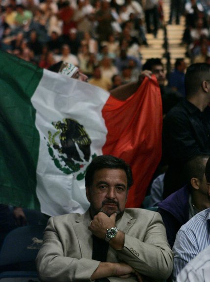 New Mexico governor Bill Richardson takes in the Joel Casamayor-Juan Manuel Marquez lightweight title fight at the MGM Grand Garden Arena in Las Vegas Saturday night. Richardson was one of many Latinos in attendance celebrating the Mexican Independence Day Weekend's traditional big boxing match.