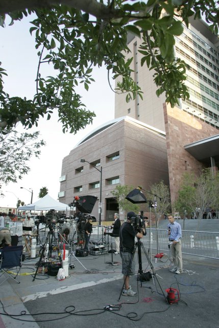 Television news reporters broadcast live from behind the Clark County Regional Justice Center for the first day of the O.J. Simpson trial in Las Vegas, Nev., Monday, Sept. 15, 2008. Simpson is facing charges which include burglary, robbery and assault following an alleged robbery at the Palace Station Hotel & Casino in September, 2007.