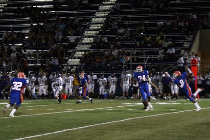 Sam Aigbe (34) and D'ere Moore (8) try to intercept a pass during Friday's game against Durango. Neither player caught the ball.