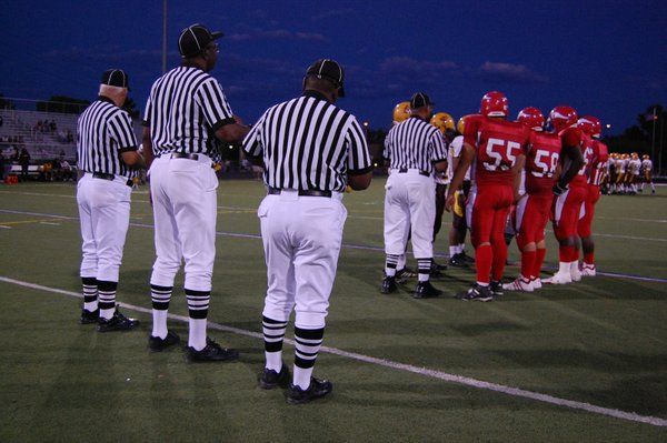 The Valley and Eldorado captains wait for the coin toss ...