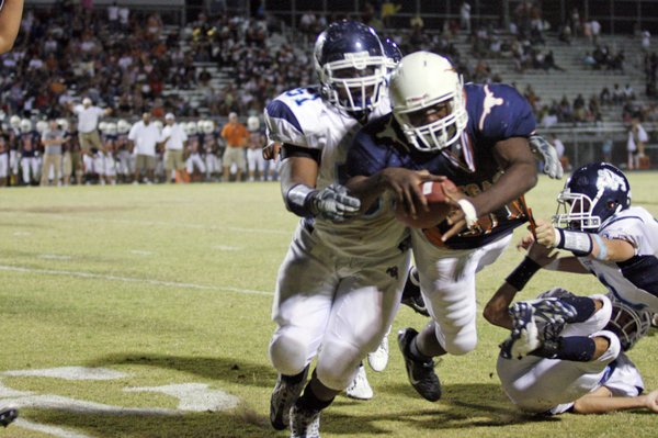 Legacy running back Prince Oroke leaps for a touchdown during ...