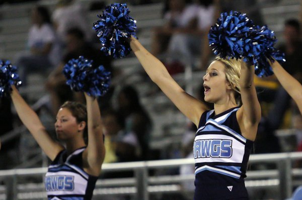 Centennial cheerleader Torri Altrache, right, cheers on the Centennial football ...