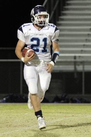 Centennial wide receiver Matt Holley makes a run for the ball during Friday's football game against Legacy High School.