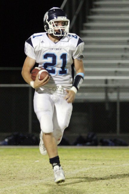 Centennial wide receiver Matt Holley makes a run for the ball during Friday's football game against Legacy High School.